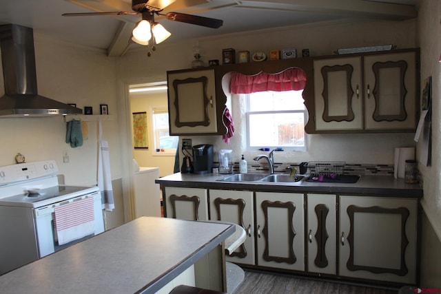 kitchen featuring wall chimney exhaust hood, ceiling fan, sink, beamed ceiling, and range