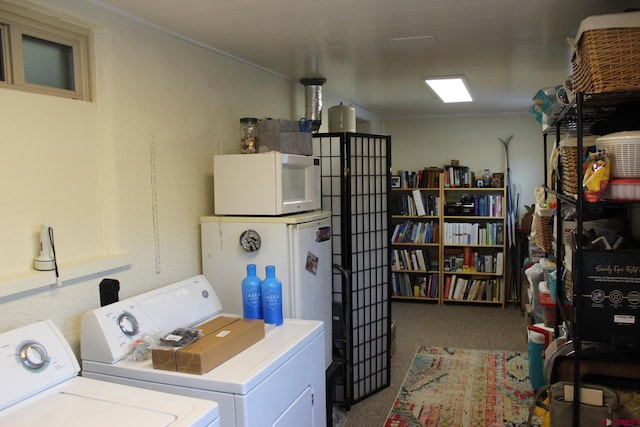 laundry room featuring carpet and separate washer and dryer