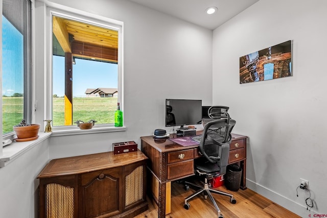 office space with light hardwood / wood-style flooring