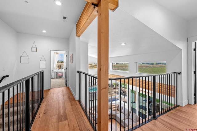 hall with hardwood / wood-style floors