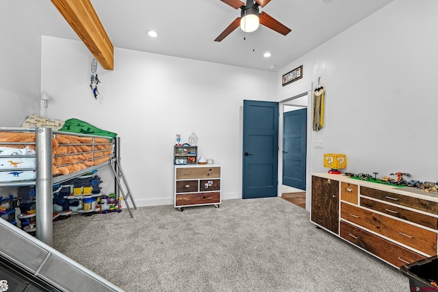 bedroom featuring ceiling fan, beam ceiling, and carpet floors