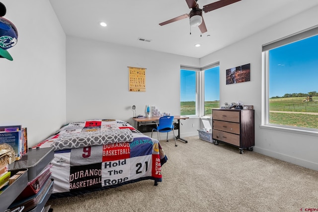 bedroom with ceiling fan and carpet floors