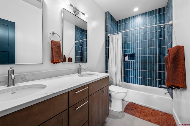 full bathroom featuring toilet, shower / bath combination with curtain, vanity, and tile patterned floors