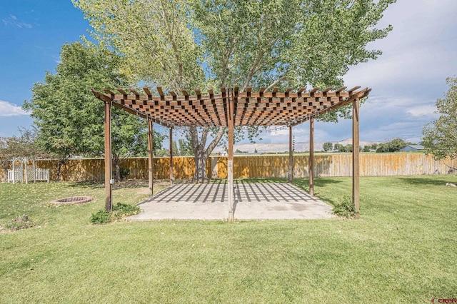 view of yard featuring a pergola and a fire pit