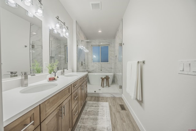 bathroom with vanity, separate shower and tub, and wood-type flooring