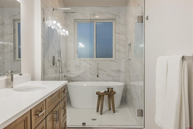 bathroom with vanity, independent shower and bath, and tile walls