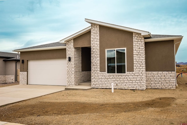 view of front of home with a garage