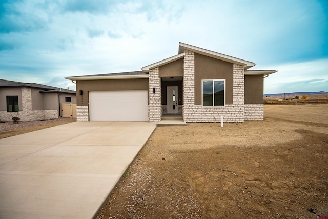 view of front of property featuring a garage