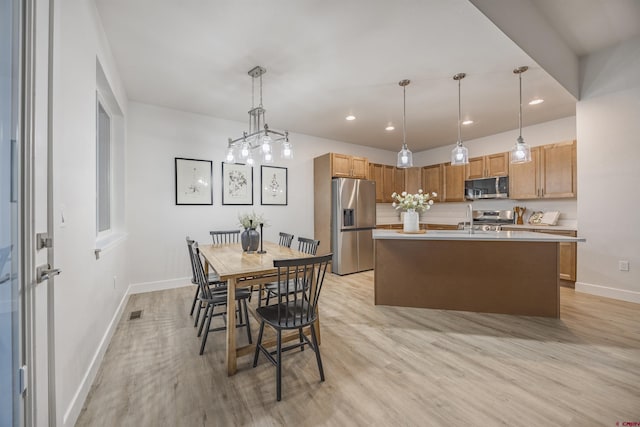 dining space featuring light hardwood / wood-style flooring