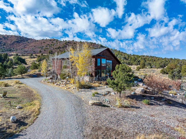 view of front of home featuring a mountain view