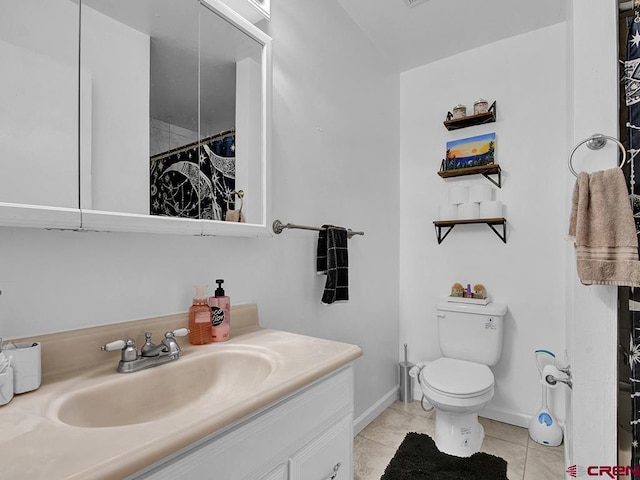 bathroom featuring tile patterned flooring, vanity, a shower with shower curtain, and toilet