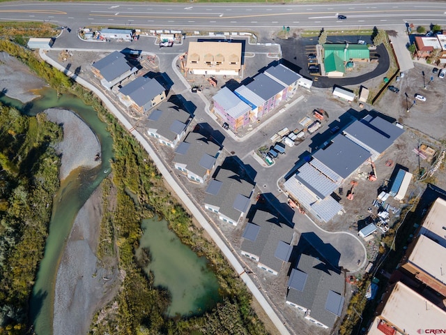 birds eye view of property featuring a water view