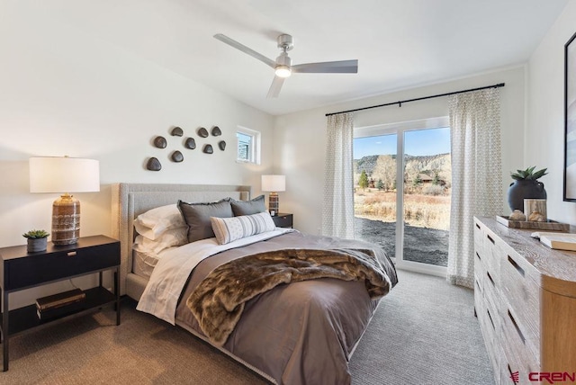 bedroom with carpet floors, access to outside, and a ceiling fan