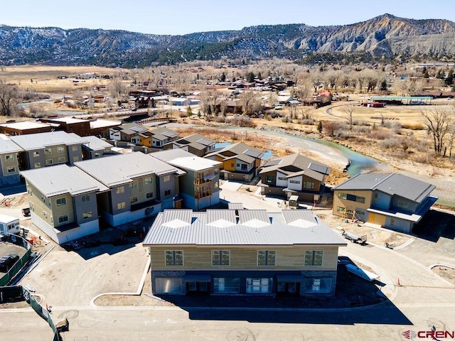 drone / aerial view featuring a mountain view and a residential view