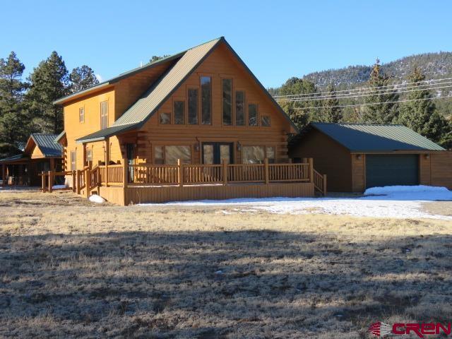 log cabin with a garage