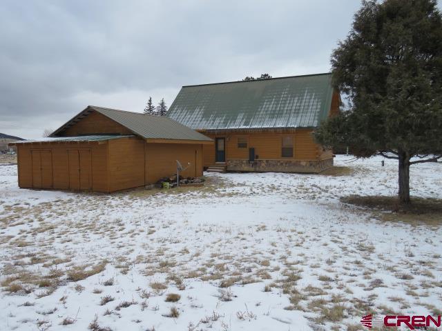 view of snow covered property