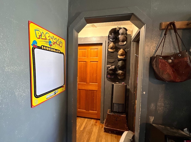 corridor with light hardwood / wood-style flooring