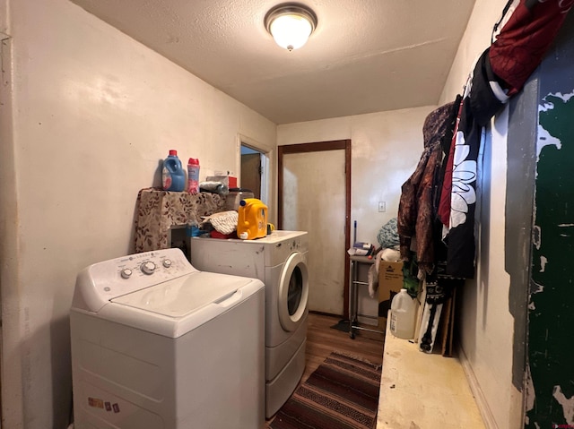 laundry room featuring separate washer and dryer and dark wood-type flooring