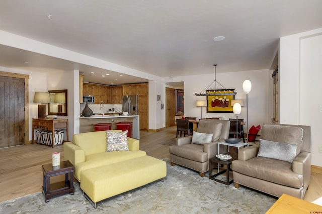 living room with light hardwood / wood-style flooring