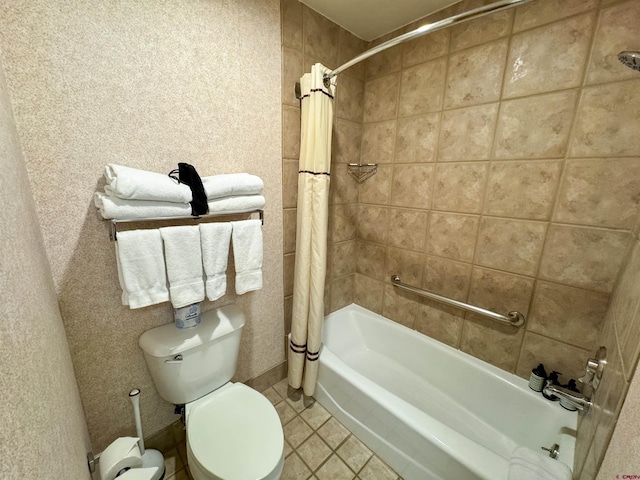 bathroom featuring shower / bath combo with shower curtain, tile patterned flooring, and toilet