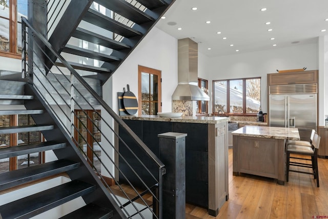 stairway featuring wood-type flooring