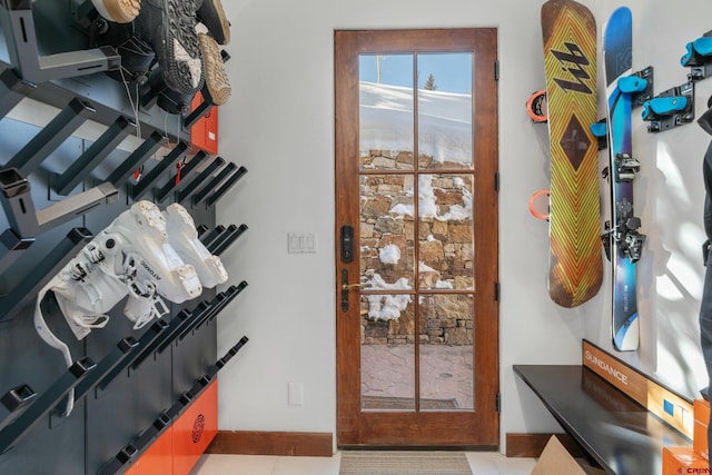 doorway featuring tile patterned flooring