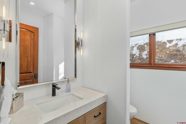 bathroom with vanity and toilet