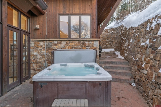 exterior space featuring french doors and a hot tub