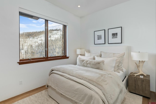 bedroom with light wood-type flooring