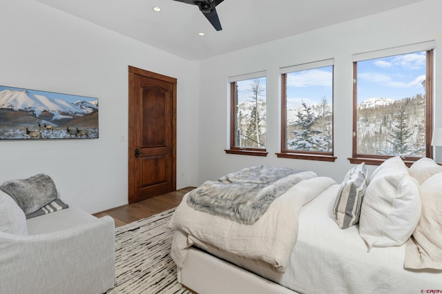 bedroom with ceiling fan and light hardwood / wood-style flooring