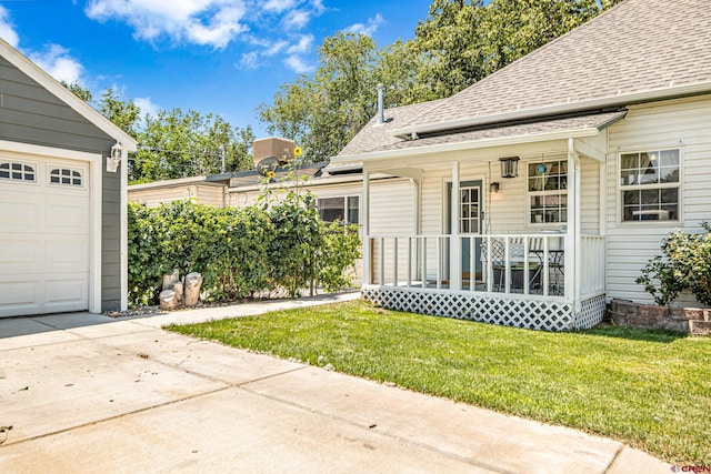 exterior space featuring a porch and a garage