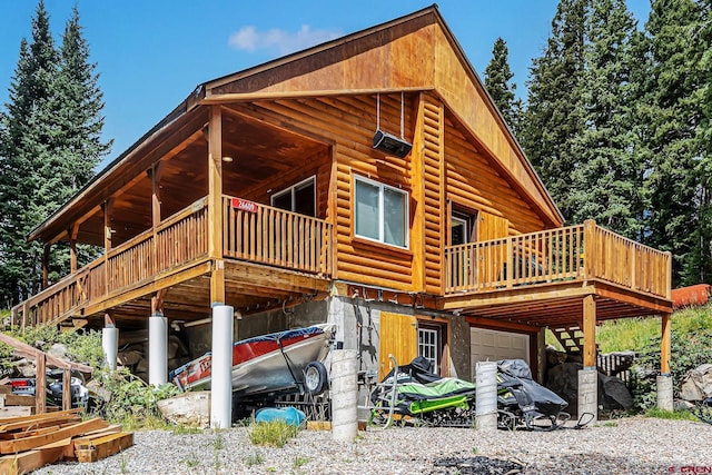 view of home's exterior with a garage and a deck