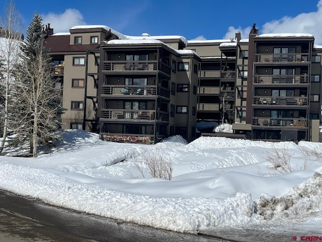 view of snow covered property