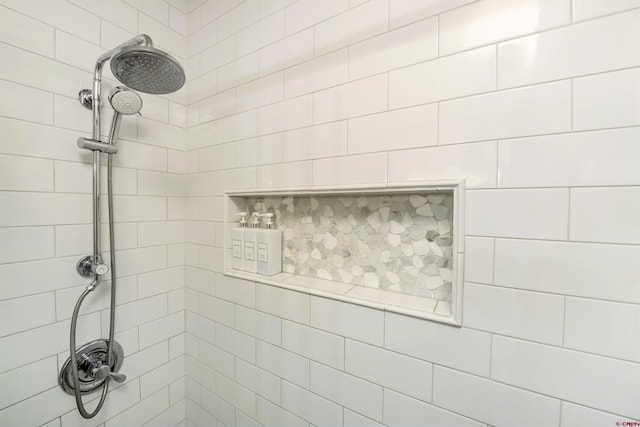 bathroom with a tile shower