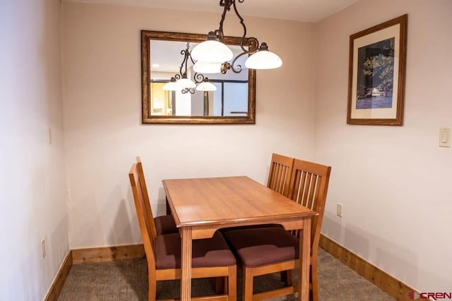 view of carpeted dining space