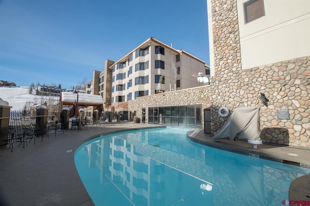 view of snow covered pool