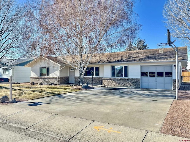 ranch-style house featuring a garage