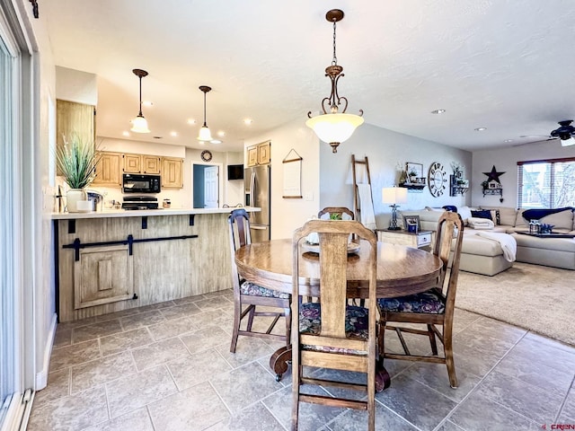 dining area with ceiling fan