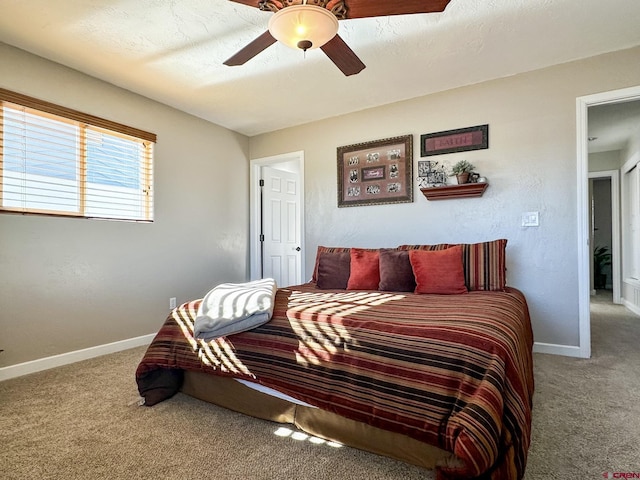 bedroom with ceiling fan and carpet