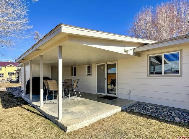 back of property with a patio area