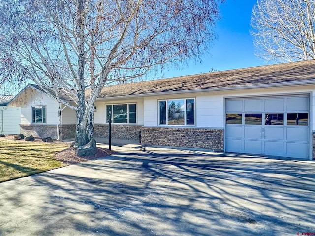 ranch-style home featuring a garage