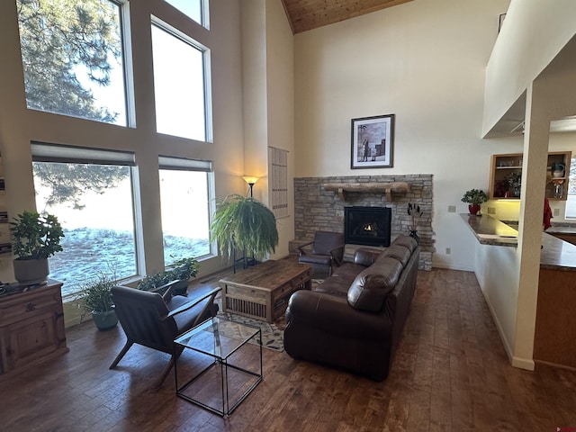 living room featuring a fireplace, wooden ceiling, high vaulted ceiling, and dark wood-type flooring