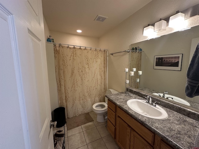 bathroom featuring tile patterned flooring, vanity, toilet, and a shower with shower curtain