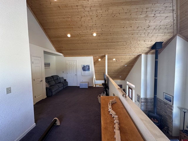 hallway featuring high vaulted ceiling and wood ceiling