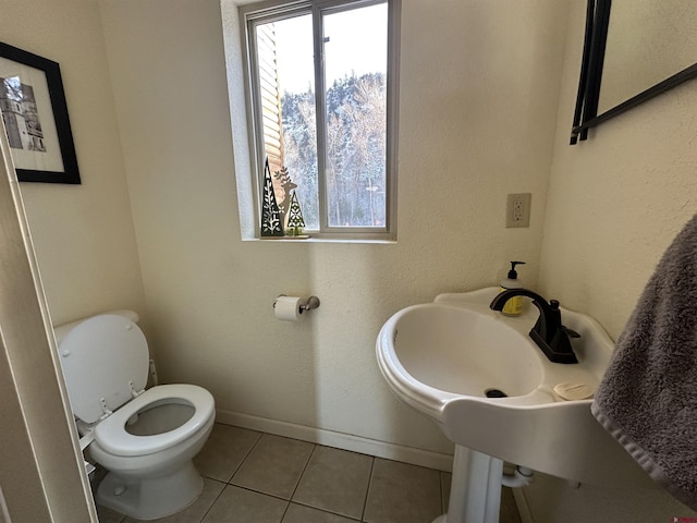 bathroom featuring tile patterned floors and toilet