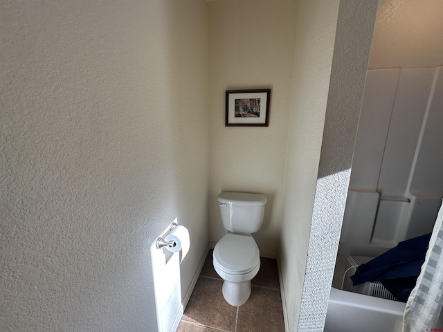 bathroom with tile patterned floors and toilet