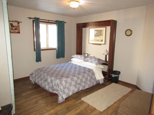 bedroom featuring dark hardwood / wood-style floors