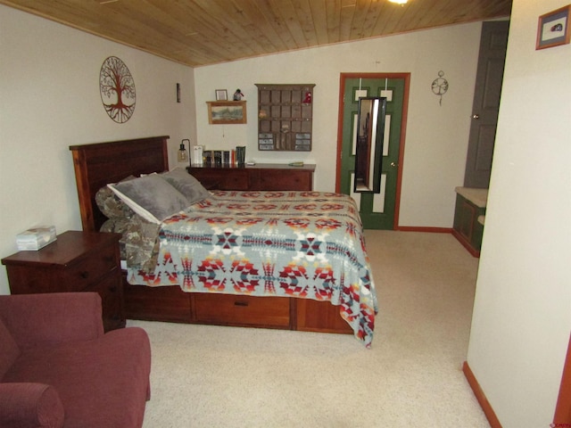 carpeted bedroom with wooden ceiling and vaulted ceiling