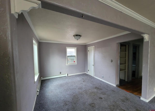 empty room with a baseboard heating unit, dark carpet, and crown molding