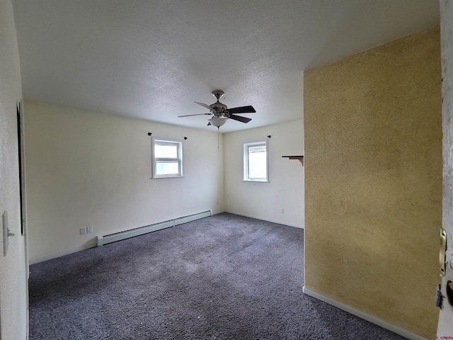 unfurnished room with ceiling fan, a baseboard radiator, a textured ceiling, and dark colored carpet